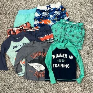 Bundle of 12m swim. Great condition! 5 bottoms, 3 long sleeve rash guards!
